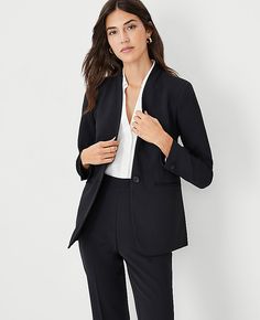 Elevate your wardrobe with the Ann Taylor Long Collarless Blazer, a masterpiece of modern tailoring. This sleek, black blazer is designed without a collar to create a streamlined silhouette that is both sophisticated and versatile. Perfect for various occasions, from professional meetings to evening outings.

- **Size:** 14 Regular
- **Color:** Black
- **Material:** 95% Polyester, 5% Spandex
- **Fit:** Tailored fit
- **Length:** Hits at hip, approximately 27" long
- **Sleeves:** Long, with butto Collarless Blazer Outfits For Women, Black Blazer Outfit Work Business Professional Women, Black Blazer Outfit Dressy, Tailored Suit Women, Black Suit Women, Modern Tailoring, Black Blazer Outfit, Collarless Blazer, Long Sleeve Suit