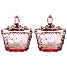 two pink glass covered dishes with lids