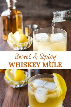 a glass filled with whiskey and ice sitting on top of a wooden table