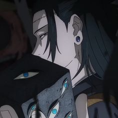 an anime character with blue eyes and black hair looking at something in front of him