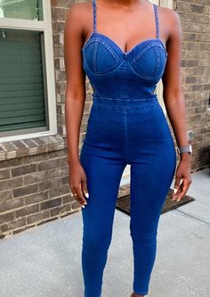 Hey hot stuff! Ready to hit the town? This dark blue denim jumpsuit is built to show off your curves! It features adjustable straps and padded bra cups to get a fit that is just right. The side cut out detail provides just enough flare to turn heads! Day or night this jumpsuit will transition! Step into your new hot look today. Model is 5'4 wearing a size Small 74% cotton, 23% polyester, 3% spandex Side cut-outs Adjustable cami straps Skinny leg Concealed back zipper closure Square cut back Unde Hey Hot Stuff, Blue Jean Jumpsuit, Natural Hair Removal, Plain Jane, Concert Looks, Dark Blue Denim, Denim And Lace, Side Cuts, Dark Blue Jeans