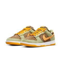 The Nike Dunk Low Dusty Olive is a classic sneaker updated for today. The combination of dusty olive, brown, and pro-gold suede makes this sneaker perfect for any outfit. The brown canvas wraps around the heel leading to a white embroidered “NIKE” logo resting on a Pro Gold suede heel tab. The pro-gold outsole and a white midsole complete the look of this retro Nike Dunk. Dunk Low Dusty Olive, High Air Force 1, Nike Models, Exclusive Sneakers, Adidas Spezial, Jordan Sneakers, Adidas Campus, Air Jordan 3, Latest Sneakers