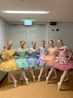 six ballerinas are posing for the camera in their tutu skirts and dresses