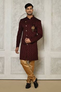 Maroon sherwani with all over floral mandala pattern.
Components: 1
Pattern: Woven
Type Of Work: Floral Mandala
Neckline: Stand Collar
Sleeve Type: Full Sleeves
Fabric: Sherwani: Jaquard
Color: Maroon
Other Details: 
Closure: Front buttons
Embellished brooch detailing
Note: Pocket square and churidar worn by the model is not for sale
Occasion: Sangeet - Aza Fashions Maroon Sherwani, Sherwani For Men, Floral Mandala, Dark Beige, Fashion App, Churidar, Mandala Pattern, Full Sleeves, Pocket Square