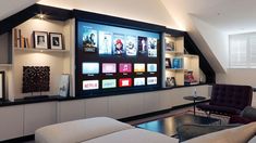 a large flat screen tv mounted to the side of a wall in a living room