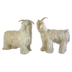 two stuffed goats standing next to each other