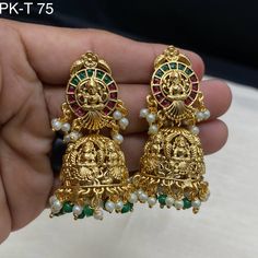 Gold Jhumka Temple Jewelry/Temple Earrings/Temple Jhumka/South Indian Jewelry/Gold Earrings/Indian Jewelry/Sabyasachi Jewelry Elevate your style with the timeless elegance of our Exquisite South Indian Kundan Jhumka. These traditional earrings are a perfect blend of sophistication and cultural heritage, exuding charm and grace with every sway. Crafted with utmost precision, these jhumkas showcase intricate Kundan work, a hallmark of South Indian jewelry craftsmanship. The dazzling array of uncut gemstones set in rich gold plating adds a touch of opulence to your ensemble, making them perfect for special occasions and celebrations. Whether you're a bride looking for the perfect accessory to complement your wedding attire or someone who appreciates the allure of Indian jewelry, our Exquisite Brass Chandbali Jhumkas For Rituals, Brass Jhumkas For Rituals And Festivals, Multicolor Earrings For Diwali Rituals, Brass Temple Jewelry Jhumkas For Rituals, Multicolor Latkans Earrings For Rituals, Temple Style Bridal Brass Earrings For Festivals, Temple Jewelry Jhumkas With Latkans For Rituals, Chandbali Jhumkas With Latkans For Puja, Temple Jewelry Jhumkas For Rituals And Festive Occasions