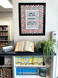 there is a book shelf with books on it and an open book in the middle