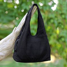 With a pintucked exterior made from 100% cotton this black cotton shoulder bag is presented by Thailand's Vinita. The chic handbag opens to reveal a black cotton lining with compartments on both sides that are secured with magnetic snaps and a main center compartment that closes with a zipper. Handbags Hobo, Pack Up And Go, Unique Handbags, Cotton Texture, Chic Handbags, Boho Casual, Women Artisans, Hobo Handbags, How To Dye Fabric