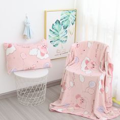 a child's chair and blanket in a room