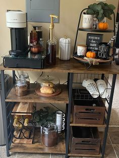 an assortment of kitchen items sitting on top of a wooden shelf next to a coffee maker