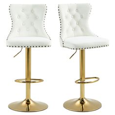 two white leatherette bar stools with gold metal base and studded trimming