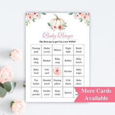 a baby shower game with pink flowers and greenery