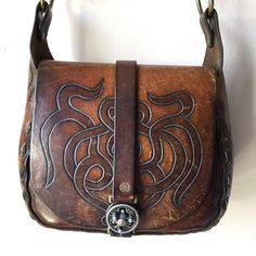 "Beautiful Vintage 60s or 70s Saddle Leather Handbag Purse Great Vintage Condition with Amazing Patina - unique hardware, and leather stitching, inside leather pocket Rough Measurements: Width: 10 1/2\" Length (the bag itself not including strap or ring handles): 9\" Depth (slightly Stretched): 4\" Will ship out between 1-3 business days once the payment has been made. Please message me w/ any questions. All sales final. And please check out my other vintage shirts!! thank you!" Retro Leather Flap Bag For Everyday Use, Retro Leather Shoulder Bag With Leather Backing, Vintage Handmade Leather Bags, Retro Bags With Brass Hardware For Everyday Use, Leather Satchel Flap Bag With Brass Hardware, Retro Shoulder Bag With Brass Hardware For Daily Use, Vintage Style Saddle Satchel For Everyday Use, Vintage Saddle Shoulder Bag For Everyday Use, Artisan Saddle Bag With Leather Lining