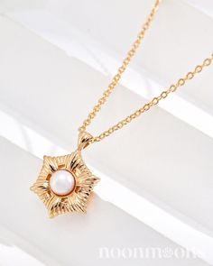 Meet our enchanting, understated 18k gold-plated choker, Moonlight Starlet. At its center, a radiant mother of pearl is nestled in a star-shaped pendant, framed by flowing, romantic rays. Each detail sparkles with a whimsical glow, adding a touch of celestial beauty to any occasion. ♥︎  DETAILS: ☽ Material: 18k Gold Plated Sterling Silver, Mother of Pearl ☽ Size: * Chain length is about 40cm + 6cm extension chain              * Pearl is about 5mm              * Width of starlet is approximately Elegant Star Charm Necklace, Tarnish Resistant, Elegant Star-shaped Tarnish Resistant Charm Necklace, Elegant Star-shaped Clavicle Necklace, Elegant Rose Gold Star Necklace, Elegant Gold Plated Charm Necklaces With Star Charm, Elegant Gold Plated Charm Necklace With Star, Elegant Gold Star Necklace, Elegant Gold Necklace With Star Charm, Elegant White Star Charm Necklace