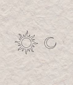 the sun and moon are drawn on paper