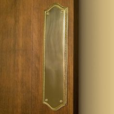 a wooden door with a metal handle on it