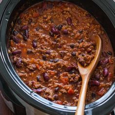 a slow cooker filled with chili and beans