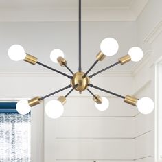 a modern chandelier hangs from the ceiling