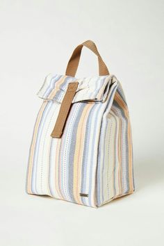 a multicolored striped bag on a white background