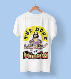 "Get ready to rock and roll in style with our exclusive The Dude Of Bonnaroo T-Shirt. Designed for true music lovers and fans of \"The Big Lebowski,\" this unique shirt brings together the best of both worlds. Crafted with style and comfort in mind, this T-shirt is made from a premium blend of fabrics that ensure a soft and breathable feel all day long. Whether you're headbanging to your favorite band or chilling like The Dude, this shirt has got you covered. The high-quality print ensures vivid colors and sharp details that won't fade, even with frequent wear. This T-shirt is a timeless keepsake, celebrating the spirit of the festival and the iconic character of The Dude. Make a statement and spark conversations wherever you go with this limited edition T-shirt. Perfect for festival enthu Splendour In The Grass, Rock Festival, Big Lebowski, Festival Gear, The Dude, Burning Man Festival, Rock Festivals, Festival T Shirts, The Big Lebowski