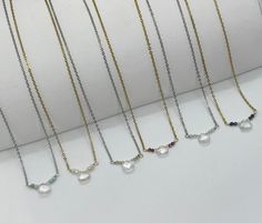 "Dainty Minimalist Sparkling Genuine Gemstone Birthstone Necklace. A shimmering little rock crystal teardrop is surrounded by tiny micro-faceted crystals and gemstones (your choice). Tarnish resistant stainless steel chain (adjustable from 15\" to  17\") with lobster clasp closure. Comes on card as shown. Makes a great birthday gift. Comes in a gift bag.  DETAILS:  Measurements (approximate): Please note size - Beaded section 5/8\"-3/4\". Teardrop - 1/4\". Gemstones - 2mm. Chain length - 17\" (1 Adjustable Teardrop Crystal Necklace With Gemstone, Dainty Teardrop Birthstone Crystal Necklace, Dainty Teardrop Gemstone Crystal Necklaces, Gift Teardrop Faceted Bead Crystal Necklace, Dainty Teardrop Gemstone Crystal Necklace, Minimalist Teardrop Birthstone Crystal Necklace, White Briolette Crystal Necklace For Gifts, White Briolette Crystal Necklace Gift, Teardrop Crystal Necklace With Delicate Chain For Gift