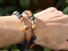 Rare Rudraksha beads bracelet with grey Lava and Oxbone prayerbeads: Lotus Flowers. Detailed hand-carved decoration. Warm natural shades. Rudraksha Beads, Prayer Bracelet, Red Tigers Eye, Lotus Flowers, Lava Stone