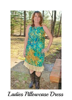 a woman wearing boots and a dress in front of some trees with the caption ladies'showcase dress