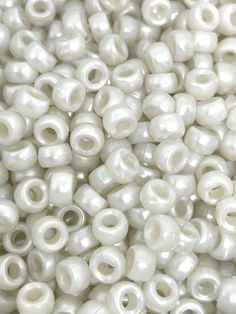 many white beads are stacked together on top of each other