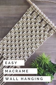 the easy macrame wall hanging is made with yarn, and it's attached to