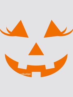 an orange halloween pumpkin face with two large horns on it's head, and the words happy halloween written below