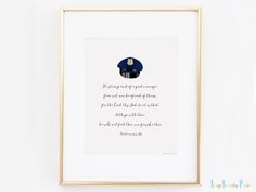 a framed print with a quote on it in a gold frame against a white wall