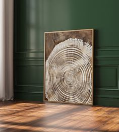 an abstract wood art piece in a green room