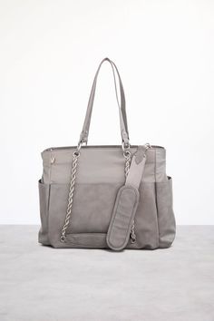 a gray handbag sitting on top of a table