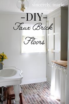 a white sink sitting under a window in a bathroom