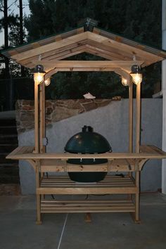 an outdoor bbq grill with lights on it