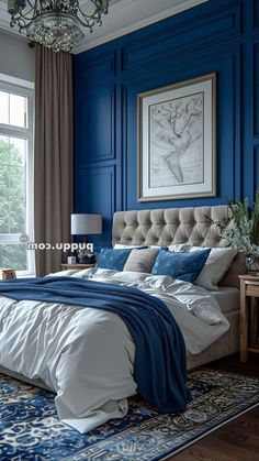 a bedroom with blue walls and white bedding, chandelier hanging from the ceiling