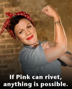 a woman with tattoos and a red bandana on her head is posing for the camera