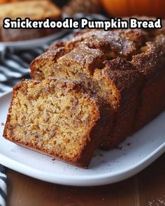 two slices of pumpkin bread on a plate with the words, snickkerdoodle pumpkin bread