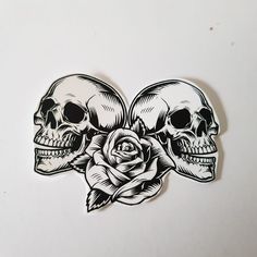 two skulls with roses on their heads are shown in black and white vinyl decals