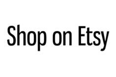 the words shop on etsy are in black and white letters, against a white background