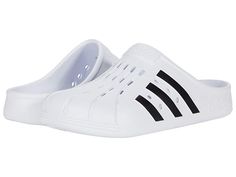 adidas Adilette Clog - Shoes : Footwear White/Core Black/Footwear White : Slip-on adidas Adilette Clog for everyday comfort. Based on the iconic adidas slide, these clogs are as functional as they are comfortable. Whether you're walking to the gym or pool for an early-morning workout or just want to keep the slouchy-casual vibe going all through your day, slip your feet into the contoured EVA footbeds and head for the door. Synthetic upper, lining, and insole. Slip-on construction. Regular fit. Sporty Synthetic Slip-on Clogs, Sporty Non-slip Synthetic Clogs, White Breathable Sports Clogs, Breathable Synthetic Clogs For Streetwear, Synthetic Round Toe Clogs For Sports, White Sporty Clogs For Sports, Sporty White Clogs For Sports, Sporty Non-slip Clogs For Streetwear, Functional Slip-on Sports Clogs