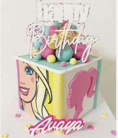 a birthday cake that is decorated with barbies