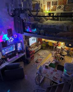 an aerial view of a living room and bedroom area in a house with lights on the ceiling