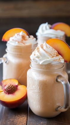 two mason jars filled with whipped cream and peaches