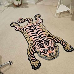 a tiger rug is laying on the floor