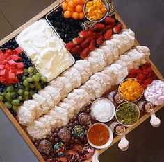 a table topped with lots of different types of food on top of eachother