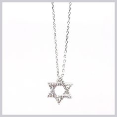 This sparkling necklace is a newer version of the classic Star of David. The perfect size to wear all the time with sparkling CZ pavé to catch the eye. The star moves freely on a delicate chain. Available in sterling silver or gold vermeil. Pendant is 1/2" in diameter, hung on a 16" sterling silver chain with 2" extender. Made by Felix Z Designs Sterling Silver Star Necklace With Diamond Accents, Star Of David Necklace In Cubic Zirconia As Gift, Sterling Silver Star Diamond Necklace, Star-shaped Cubic Zirconia Diamond Necklace Gift, Dazzling Star-shaped White Gold Necklace, Dazzling Star Shaped White Gold Necklace, Dazzling White Gold Star Necklace, Sterling Silver Star Of David Fine Jewelry Necklace, Sterling Silver Star Necklace In Fine Jewelry Style