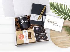 a welcome gift box with coffee, chocolates and cards