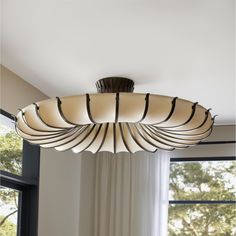 a light fixture hanging from the ceiling in a living room